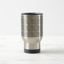 White snowflakes on silver coffee mug