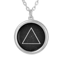 White triangle outline on black star background necklace