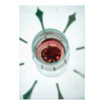 Wine glass with flower petals inside photograph