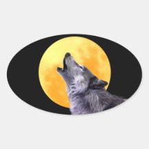 Wolf howls at the full moon oval stickers