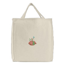 Woman holding butterfly embroidery canvas tote bag