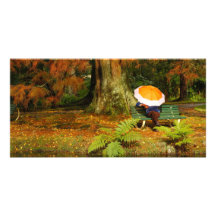 Woman siting with umbrella picture card