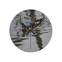 Wood Ducks Swimming In Lake Clock