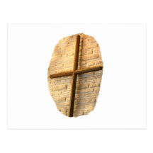 Wooden thin cross on white brick church wall post card