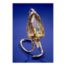 Yellow 'Incomparable' diamond in a gold setting posters