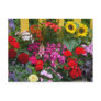 Yellow picket fence with flower garden in