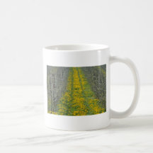 yellow Tree nursery in the spring with dandelions Coffee Mug