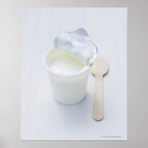 Yoghurt in opened disposable cup posters
