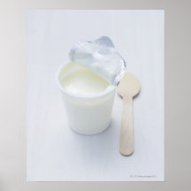 Yoghurt in opened disposable cup posters