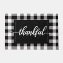Search for black and white checkered doormats For her