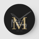 Search for black and gold decor clocks Typography