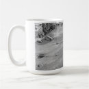 Search for footprints in the sand mugs Water