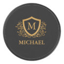 Search for gold hockey pucks Black and gold