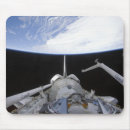 Search for manipulate mousepads Robotic arm