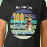 100 Days of School Dinosaur Student Monogrammed T-Shirt<br><div class="desc">The 100 Days of School Dinosaur student design is the perfect way to celebrate the milestone of your 100th school day! This cute and fun dinosaur design showcases just how "dino-mite" school can be. This shirt is designed to bring joy and excitement to your day. With its colourful vintage retro...</div>
