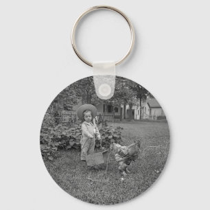 1880's Adorable Girl and Rooster Cart in Garden Keychain