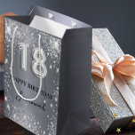 18th birthday silver glitter glamourous monogram medium gift bag<br><div class="desc">Elegant,  classic,  glamourous and girly for a 18th birthday party.  A silver metallic background. Decorated with glitter dust. Personalize and add a name.  With the text:  Happy Birthday.  The name is written with a modern hand lettered style script.   Number 18 is written with a balloon style font.</div>