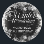 18th Birthday Winter Wonderland Snowflake Favour Classic Round Sticker<br><div class="desc">Elegant winter wonderland 18th birthday invitation features beautiful calligraphy surrounded by a lush snowflake and snow border. The snowflakes pop against the dark black background. You can actually change the background colour to any colour. Winter Wonderland can't be changed, but all of the remaining text can be edited. This item...</div>