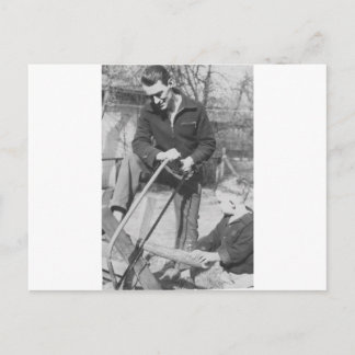 1920's Son Helping his father saw wood Postcard