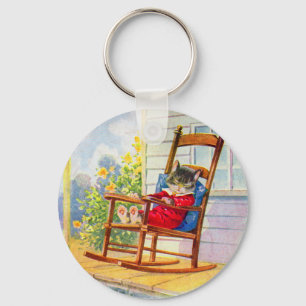 1930s adorable kitten napping on porch rocker keychain