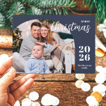 1 photo Christmas arch modern minimalist blue Holiday Card<br><div class="desc">This elegant and modern Christmas greeting card features a minimalist design displaying 1 of your favourite family pictures inside a trendy arch frame. Easily customizable with your family name and the current year in stylish serif fonts over a classic blue background.</div>