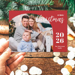 1 photo Christmas arch modern minimalist red Holiday Card<br><div class="desc">This elegant and modern Christmas greeting card features a minimalist design displaying 1 of your favourite family pictures inside a trendy arch frame. Easily customizable with your family name and the current year in stylish serif fonts over a festive red background.</div>