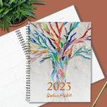 2023 Personalized Planner<br><div class="desc">This unique Planner is decorated with a brightly coloured mosaic tree. Customize it with your name and year. To edit further use the Design Tool to change the font, font size, or colour. Because we create our artwork you won't find this exact image from other designers. Original Mosaic © Michele...</div>