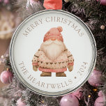 2024 Personalized Pink Santa Gnome Merry Christmas Metal Ornament<br><div class="desc">This cute holiday ornament features a pink and beige watercolor white-bearded Santa gnome in a cozy knitted sweater and hat. The words "Merry Christmas" appear in beige serif font,  with your family's name and the year below.</div>