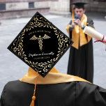 2025 Nursing School Graduation Cap Topper<br><div class="desc">Nursing graduation cap topper featuring a classic black background that can be changed to any colour,  faux gold glitter floral pattern,  the medical symbol caduceus,  name,  school,  and class year.</div>