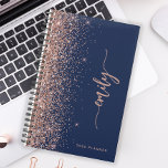 2025 Personalized Navy Blue Rose Gold Glitter Planner<br><div class="desc">Personalize this elegant modern design with your name in vertical rose pink signature handwriting script on a navy blue background trimmed with a rose gold faux glitter border. Add the year in sans serif font. (To keep the swashes at the beginning and end of the name, replace only the letters,...</div>