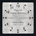 25th Silver Wedding Anniversary Square Wall Clock<br><div class="desc">25th Silver Wedding Anniversary is a special occasion. This elegant silver colour attractive design makes the ideal gift for the Anniversary Couple. Silver colour textured background, black Arabic numerals marking the hours, black lines marking the minutes decorated with 12 black hearts. Click the "CUSTOMIZE IT" button to change the names,...</div>