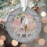 2 Photo First Christmas Engaged Grey Faux Wood Ornament<br><div class="desc">Celebrate the joyful 1st holiday of your engagement with a custom 2 photo "Our First Christmas Engaged" faux grey wood round acrylic ornament. All text and images on this template are simple to personalize and can be different or the same on front and back. (IMAGE & TEXT DESIGN TIPS: 1)...</div>