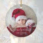 2 Photo Grandparents First Christmas White Script Ceramic Ornament<br><div class="desc">Help them celebrate their first grandchild with this beautiful modern keepsake ornament. The white text reads "Our first Christmas as grandparents, " with the word "grandparents" in elegant handwriting script with flourishes before and after. Easily replace the two sample images with your favourite photos of the new baby, and add...</div>