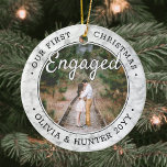 2 Photo Our First Christmas Engaged Faux Marble Ceramic Ornament<br><div class="desc">Celebrate the joyful 1st holiday of your engagement with a custom 2 photo "Our First Christmas Engaged" round faux marble ceramic ornament. All text and images on this template are simple to personalize. (IMAGE & TEXT DESIGN TIPS: 1) To adjust position of wording, add spaces at beginning or end. 2)...</div>