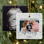 2 Photo Pregnancy New Parents 1st Xmas Expecting Ceramic Ornament<br><div class="desc">Celebrate the precious gift of your newest family member with a stylish 2 photo square faux marble ceramic ornament. Gender neutral design is suitable for a new baby boy or girl. Wording and pictures on this template are simple to personalize. (IMAGE PLACEMENT TIP: An easy way to center a photo...</div>