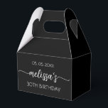 30th Birthday Simple Black Calligraphy Script Favor Box<br><div class="desc">Girly Simple Minimalist Clean Black Monogram Name Signature Script Custom Personalized 30th (or any age) birthday Favour Box. This design featuring your first name in a pretty hand lettered style swash tail font signature typography (or calligraphy), date, "any age" birthday in white on black colour background. These stylish girly feminine...</div>