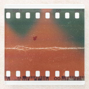 35mm filmstrip start, cool scratches. glass coaster