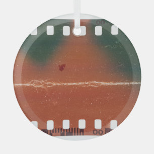 35mm filmstrip start, cool scratches. glass ornament