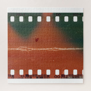 35mm filmstrip start, cool scratches. jigsaw puzzle