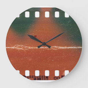 35mm filmstrip start, cool scratches. large clock
