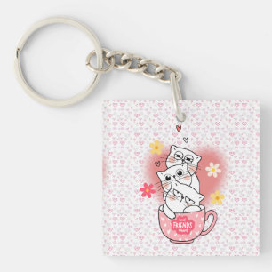 3 cats with flowes and a mug keychain