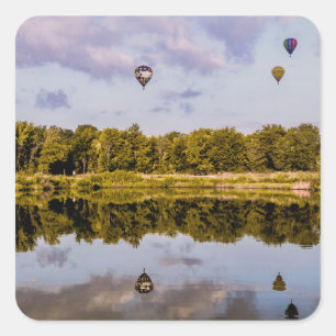 3 Hot air balloons adrift over a wooded park Square Sticker