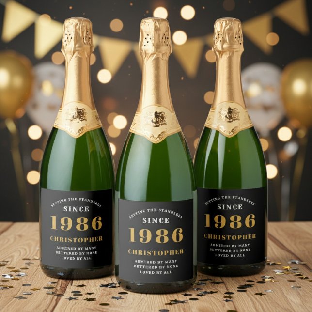 40th Birthday Born 1986 Add Name Black Gold Sparkling Wine Label (Born 1986 birthday sparkling wine bottle label. Background out of focus.)