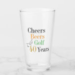 40th Birthday Cheers and Beers Golf Black and Gold Glass<br><div class="desc">This is a cool and modern, 40th birthday, golf party design. It is a simple, minimal design, in classic black and gold typography with pops of orange and green. Perfect for a cool and fun, golf and beer themed, 40th birthday party. This design is fully customizable, simply use the personalize...</div>