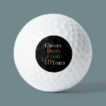 40th Birthday Golf Cheers and Beers Black and Gold Golf Balls<br><div class="desc">This is a cool and modern, 40th birthday, golf design. It is a simple, minimal design, in classic black and gold typography with pops of orange and green. Perfect for a cool and fun, golf and beer themed, 40th birthday gift or party accessory and ideal as birthday keepsakes or party...</div>