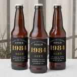 40th Birthday Name 1984 Black Gold Elegant Chic<br><div class="desc">1984 Vintage 40th Birthday Black & Gold Elegant Beer Label. Celebrate your milestone with our exclusive 1984 Vintage 40th birthday beer label. The meticulously designed label with stunning black and gold hues effortlessly enhances the visual appeal of your favourite beer. The year 1984, prominently featured on the label, adds a...</div>