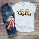50 Fifty and Fabulous Gold Glitter Brush Script T-Shirt<br><div class="desc">This design was created though digital art. You may change the style of this shirt by choosing More > under the style option. It may be personalized by clicking the customize button and changing the colour, adding a name, initials or your favourite words. Contact me at colorflowcreations@gmail.com if you with...</div>