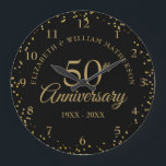 50th Anniversary Black And Gold Dust Confetti  Large Clock<br><div class="desc">Featuring delicate gold dust confetti on a black background. Personalize with your special fifty years golden anniversary information in chic gold lettering. Designed by Thisisnotme©</div>