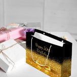 50th birthday black gold bow classic elegant large gift bag<br><div class="desc">Elegant,  classic,  glamorous and feminine style party gift bag.  A gold colored ribbon and bow with golden glitter and sparkle,  a bit of bling and luxury for a birthday.  Black background. With the text: Happy 50th Birthday!</div>