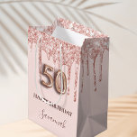50th birthday blush pink glitter drips rose gold medium gift bag<br><div class="desc">Elegant, classic, glamourous and girly for a 50th birthday party. A blush pink background. Decorated with rose gold, pink faux glitter drips, paint dripping look. Personalize and add a name. With the text: Happy Birthday. The name is written with a modern dark rose coloured hand lettered style script. Number 50...</div>